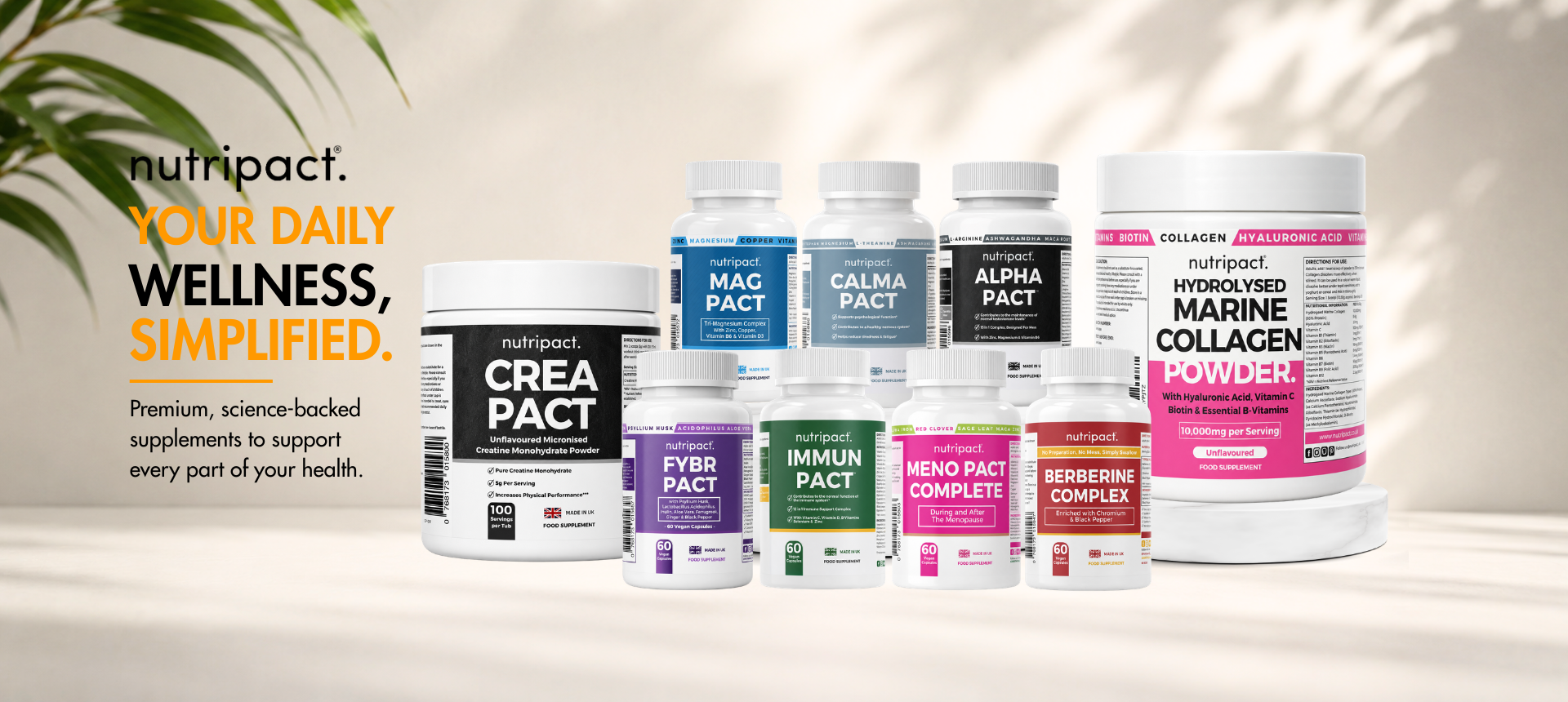 Assorted Nutripact supplement containers on a light background with greenery.